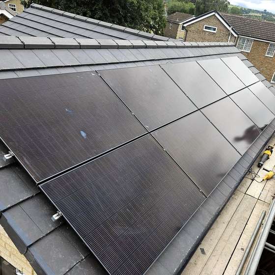Solar panels fitted on the tiled roof in Ilkley
